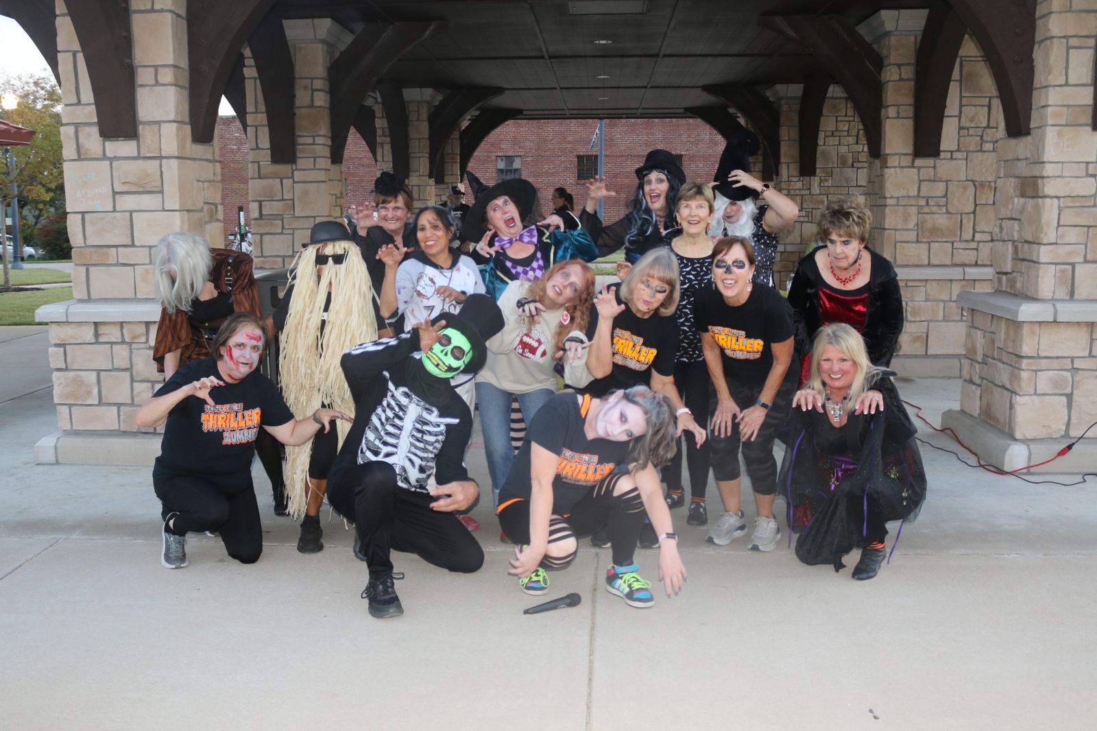 Costumed community group posing together at the downtown pavilion at a past Downtown Muskogee Halloween Boo-nanza