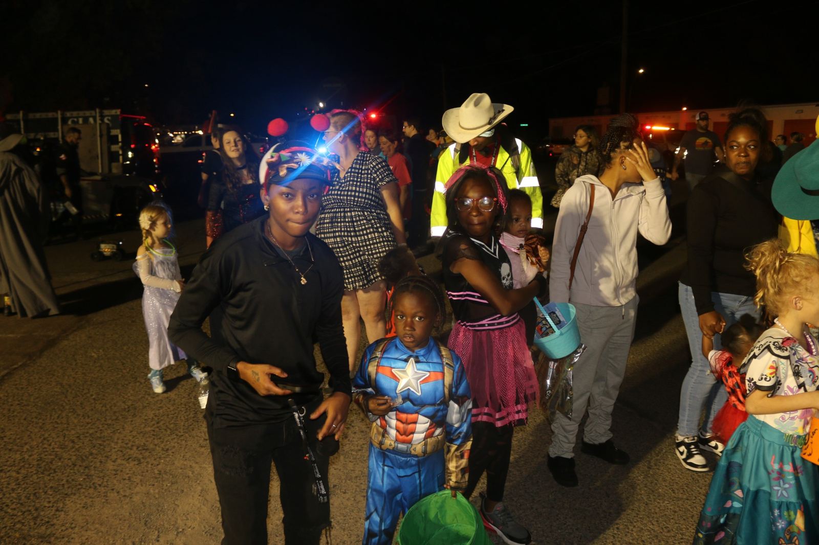 Trick-or-treaters and families gathered after sunset at a past Downtown Muskogee Halloween Boo-nanza