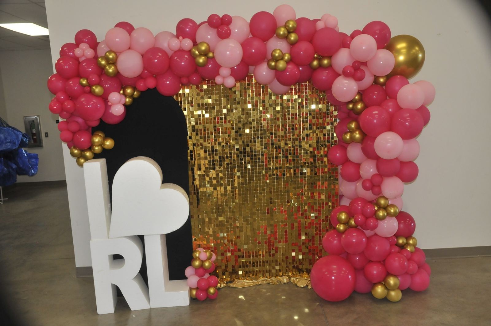 Festive welcome display with pink and gold balloons at Rhea Lana's of Muskogee October 2026
